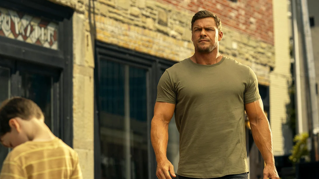 Alan Ritchson as Jack Reacher in a tense scene from the Reacher Season 4 trailer